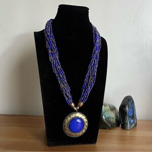 boho style multi layer seed bead, blue & gold necklace with chunky blue pendant